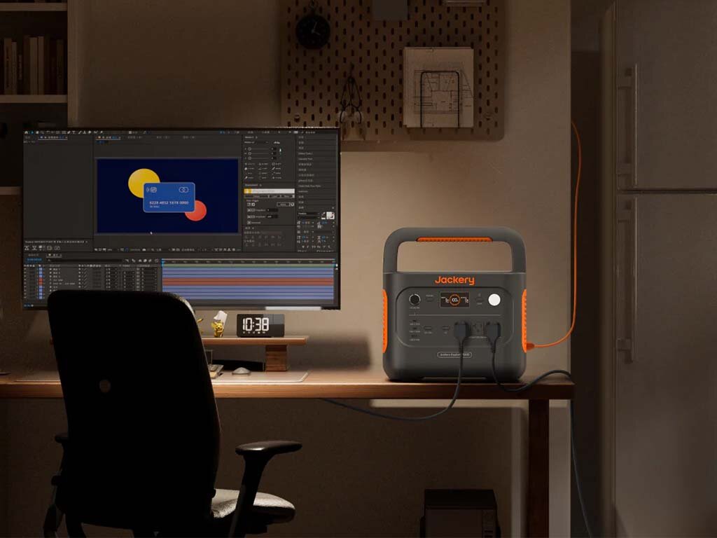 The Jackery Explorer 1000 v2 being used inside as a home backup power for a fridge and computer