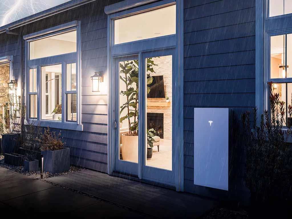 A Powerwall mounted outside of a home